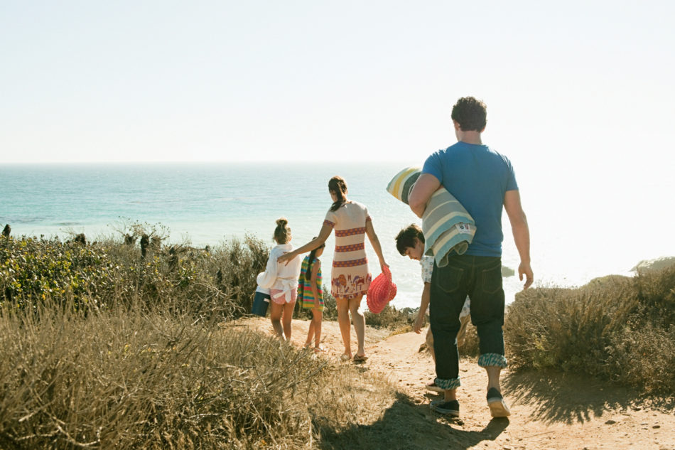 Family walking to the beach together