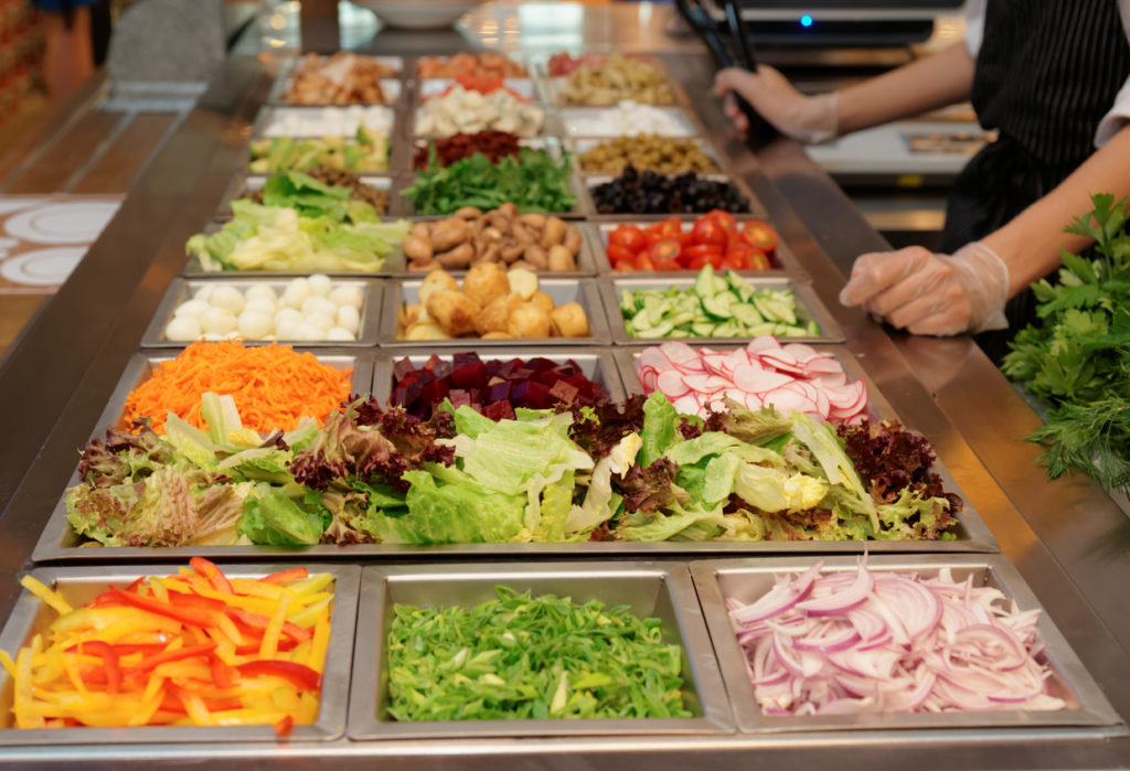 Salad bar with various fresh vegetables