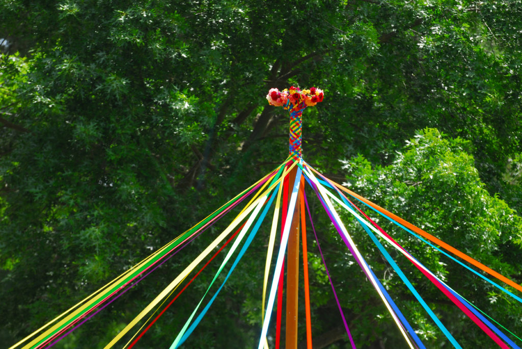 A view of the top of a Maypole during a Spring May Day celebration.
