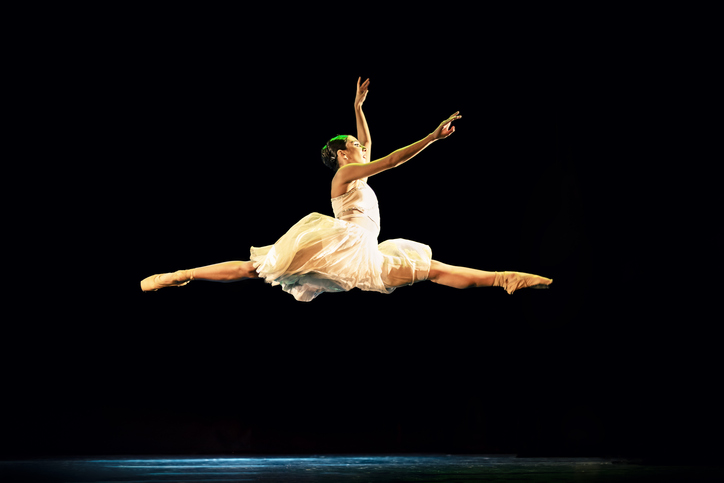Teenage girl dancing Neoclassical ballet on stage